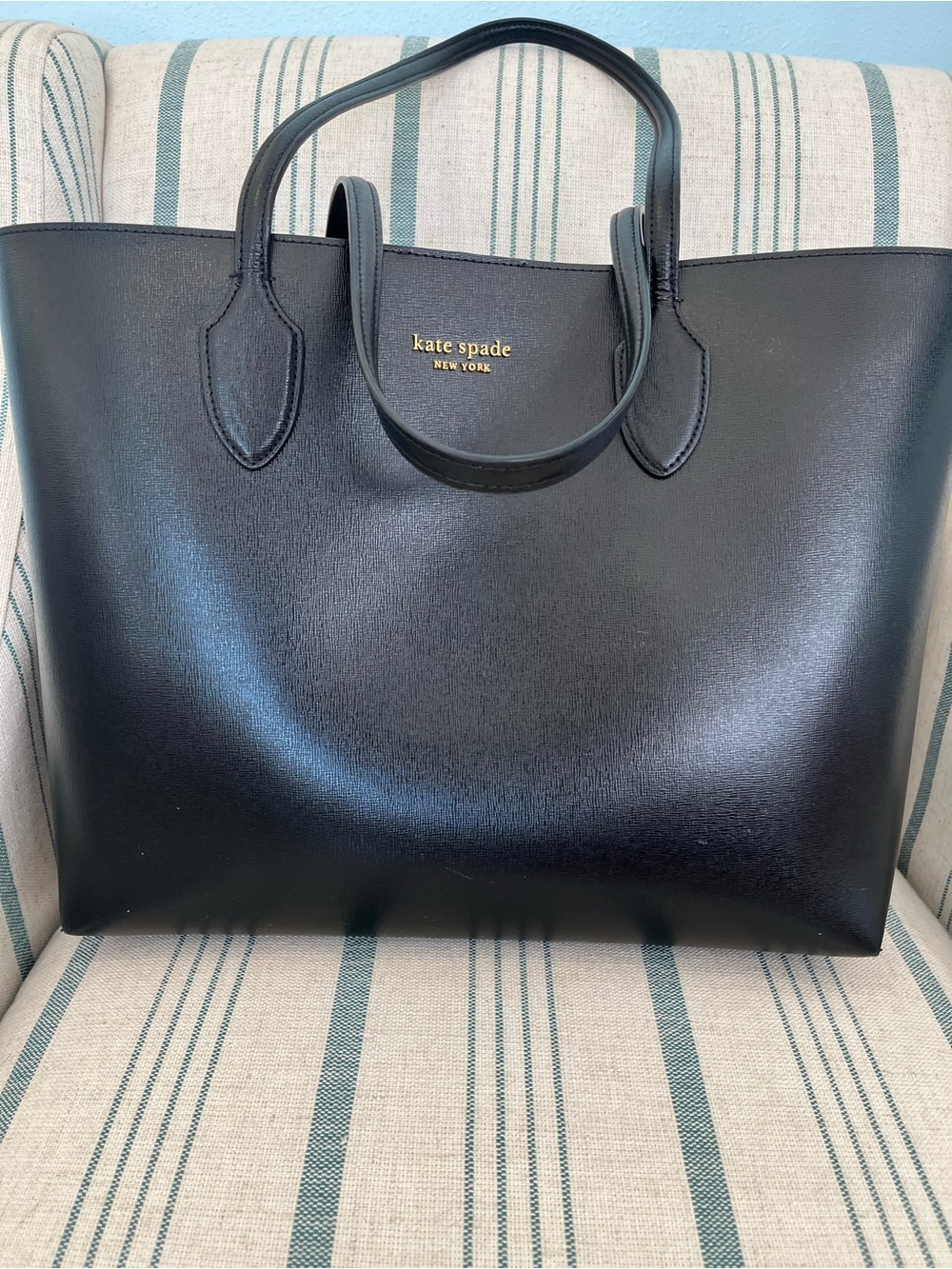 kate spade black leather tote with gold logo